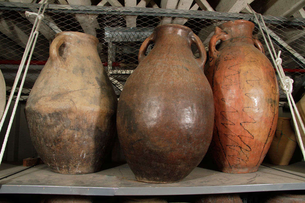 Set of three terra-cotta jars